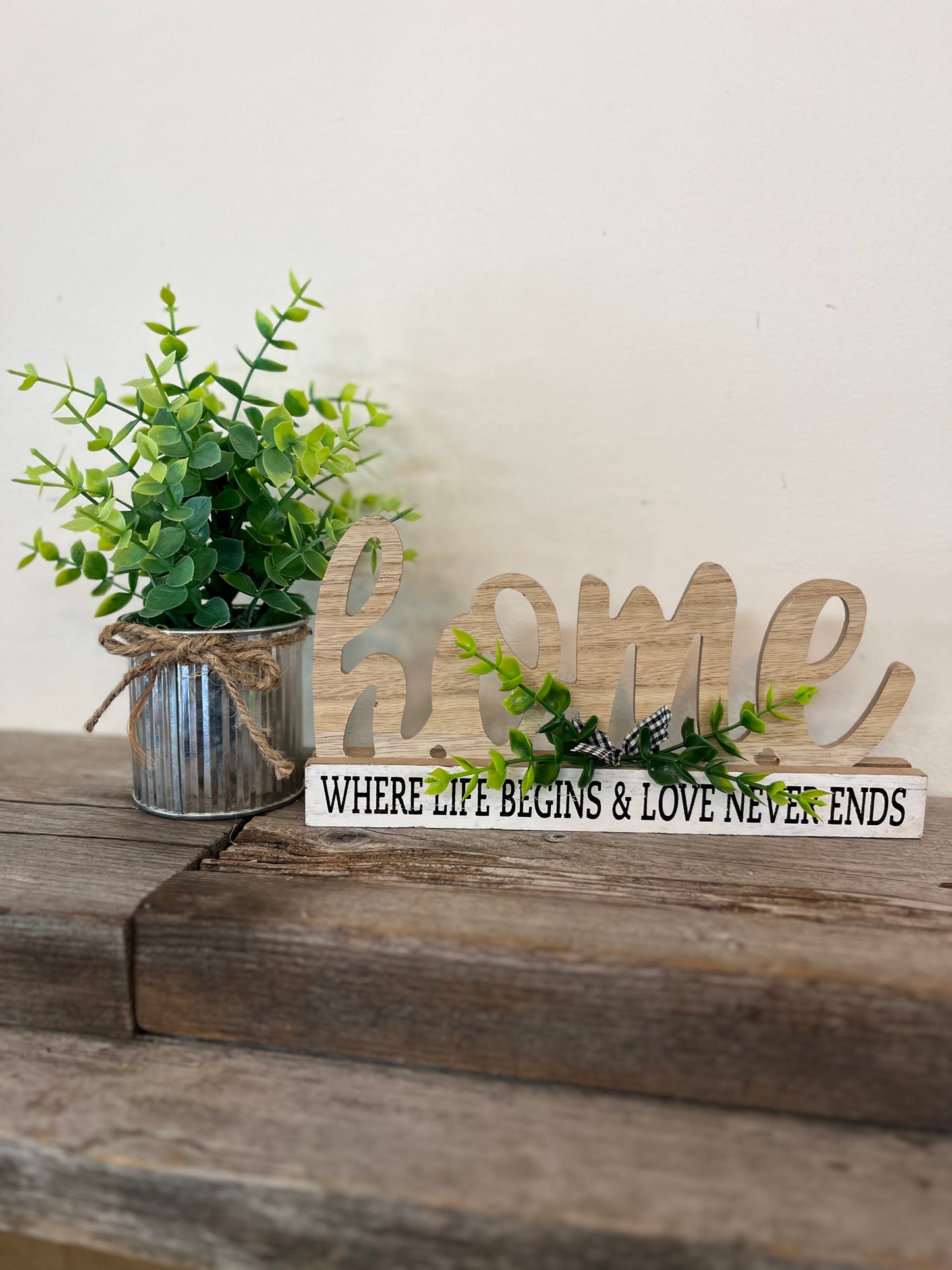 “Home” with leaves Sign