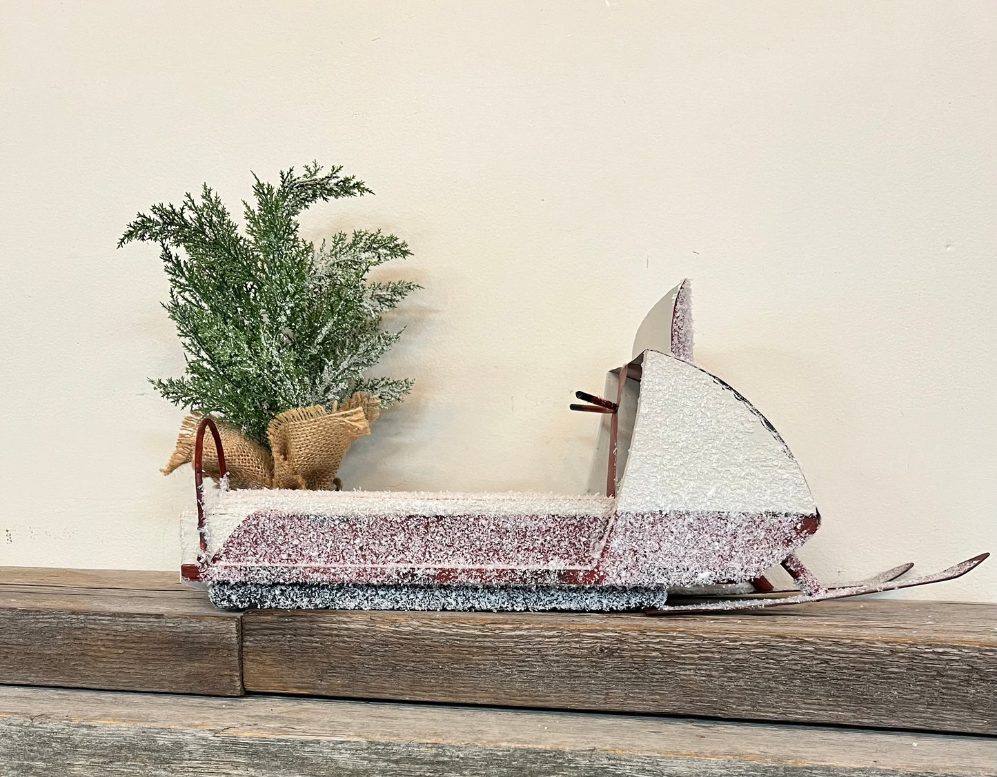 Snowy Vintage Snowmobile