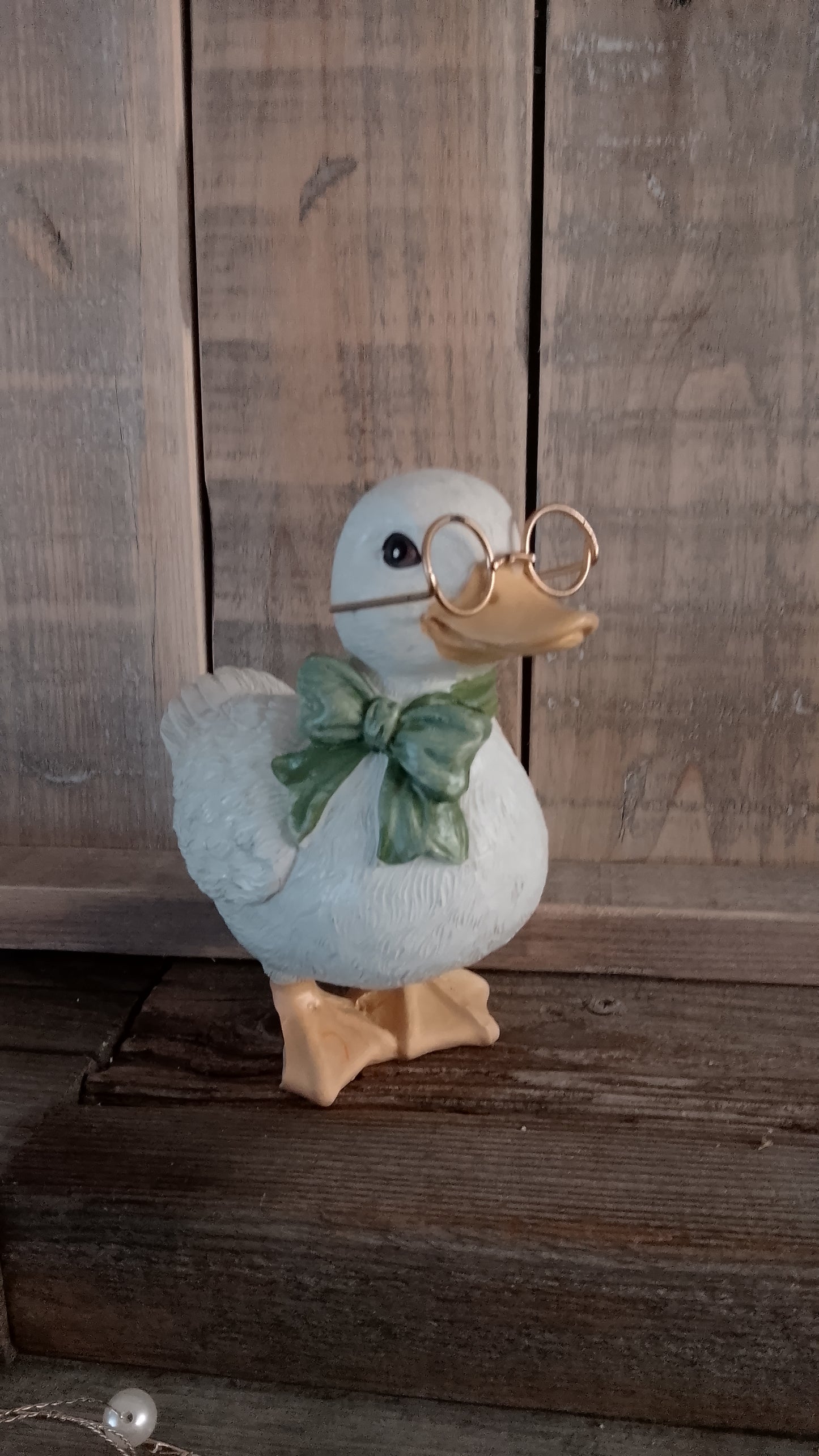 Duck figurine with glasses