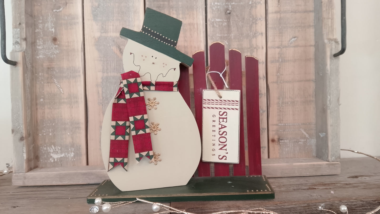 Snowman on wood stand